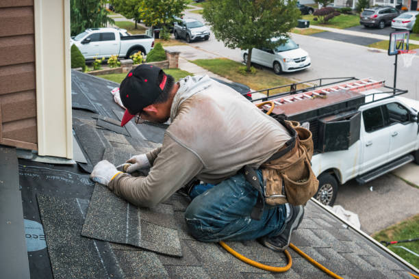 Professional Roofing technician working in Highland, KS